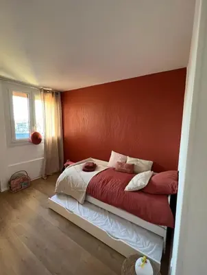 Un ou plusieurs lits dans un hébergement de l'établissement Appartement de la Famille Chat