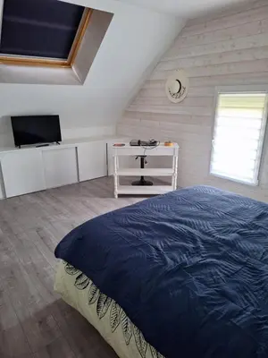 Télévision ou salle de divertissement dans l'établissement Chambres Teloché