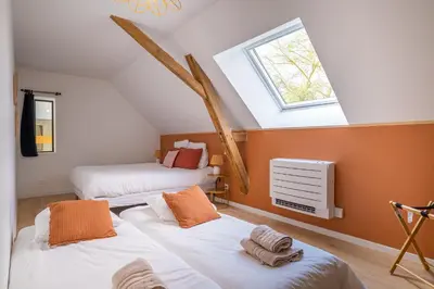 Un ou plusieurs lits dans un hébergement de l'établissement Grange de Clyna-Piscine & Spa à 10 min du circuit