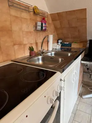Cuisine ou kitchenette dans l'établissement Studio Dorothée - Parking Privé