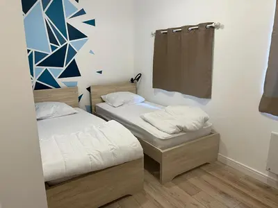 Un ou plusieurs lits dans un hébergement de l'établissement La Casita 4 min de Beauval