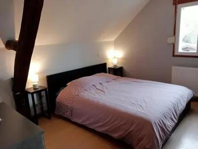 Un ou plusieurs lits dans un hébergement de l'établissement chambre d'hôtes au cœur de la nature