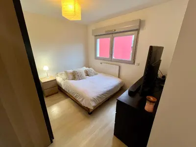 Un ou plusieurs lits dans un hébergement de l'établissement Pablo house - 24h du mans