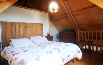 Un ou plusieurs lits dans un hébergement de l'établissement Gîte semi-troglodytique du Vieux Chai de Trôo