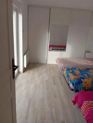 Un ou plusieurs lits dans un hébergement de l'établissement Chez Lou et Amour