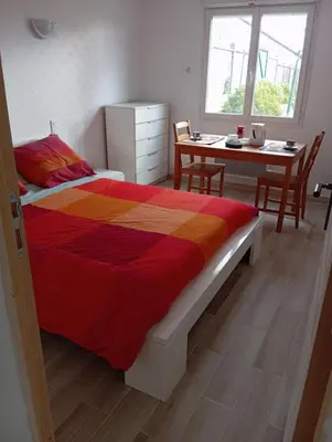 Un ou plusieurs lits dans un hébergement de l'établissement Chez Lou et Amour
