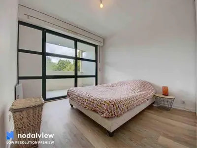 Un ou plusieurs lits dans un hébergement de l'établissement Appartement au bord du lac