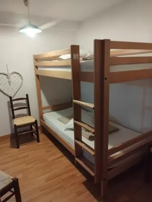 Un ou plusieurs lits dans un hébergement de l'établissement Gite La Trotiniere