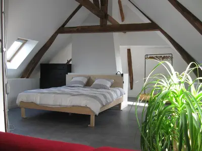 Un ou plusieurs lits dans un hébergement de l'établissement Loft du Petit Bois