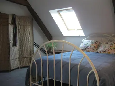 Un ou plusieurs lits dans un hébergement de l'établissement Loft du Petit Bois