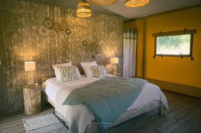 Un ou plusieurs lits dans un hébergement de l'établissement You and Me Glamping