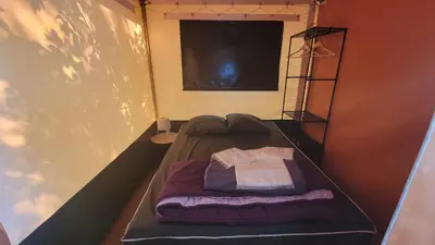 Un ou plusieurs lits dans un hébergement de l'établissement Camping La Fritillaire