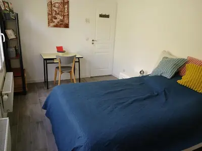 Un ou plusieurs lits dans un hébergement de l'établissement Bienvenue à la maison !