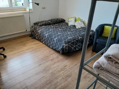 Un ou plusieurs lits dans un hébergement de l'établissement Bienvenue à la maison !