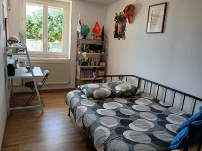Un ou plusieurs lits dans un hébergement de l'établissement Bienvenue à la maison !
