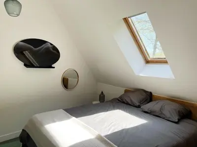 Un ou plusieurs lits dans un hébergement de l'établissement Gîte Moulin des Arts
