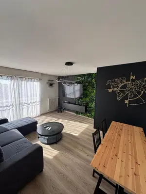 Coin salon dans l'établissement Appartement d Alex