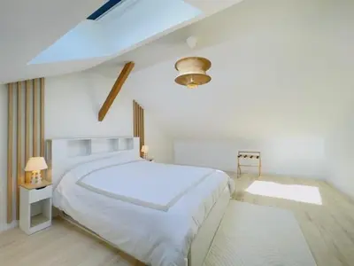 Un ou plusieurs lits dans un hébergement de l'établissement Le Luxury Lodge - 8 Voyageurs - Parking et Wifi