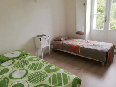 Un ou plusieurs lits dans un hébergement de l'établissement Appartement accueillant à Luynes, 60 m² avec jardin