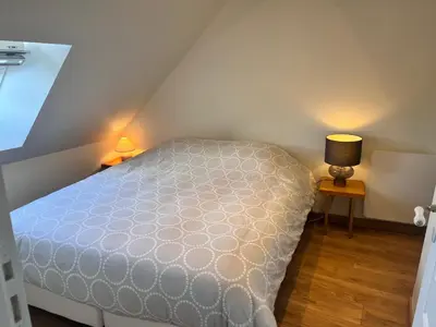 Un ou plusieurs lits dans un hébergement de l'établissement Charmante petite maison, à 5 mn de Blois