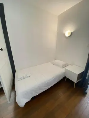 Un ou plusieurs lits dans un hébergement de l'établissement Appt 5 personnes - 2 Chambres, terrasse et jardin