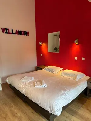 Un ou plusieurs lits dans un hébergement de l'établissement Studio 2 personnes Villandry avec jardin