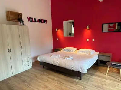 Un ou plusieurs lits dans un hébergement de l'établissement Studio 2 personnes Villandry avec jardin