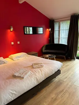 Un ou plusieurs lits dans un hébergement de l'établissement Studio 2 personnes Villandry avec jardin