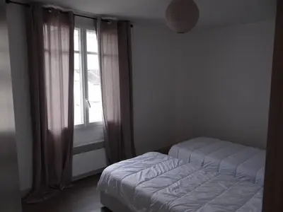 Un ou plusieurs lits dans un hébergement de l'établissement Charmante maison au cœur du village