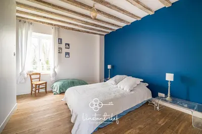 Un ou plusieurs lits dans un hébergement de l'établissement Maison cosy proche du Mans avec jardin et BBQ - l'instant clef