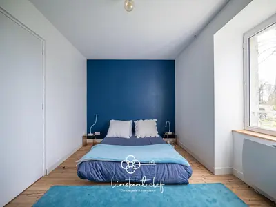Un ou plusieurs lits dans un hébergement de l'établissement Maison cosy proche du Mans avec jardin et BBQ - l'instant clef