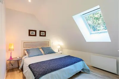 Un ou plusieurs lits dans un hébergement de l'établissement Chambres indépendantes de charme à proximité d'Amboise