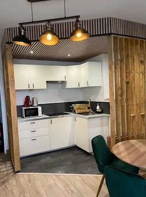 Cuisine ou kitchenette dans l'établissement L'escapade verte