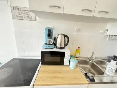 Cuisine ou kitchenette dans l'établissement L'Escale 32