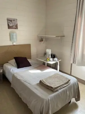 Un ou plusieurs lits dans un hébergement de l'établissement Les Chambres de la Gare