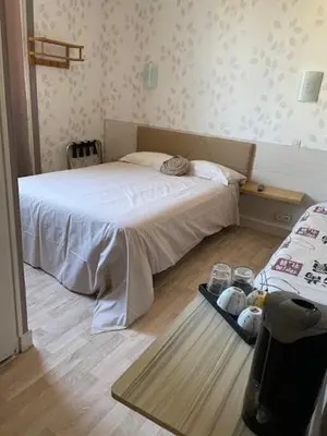 Un ou plusieurs lits dans un hébergement de l'établissement Les Chambres de la Gare