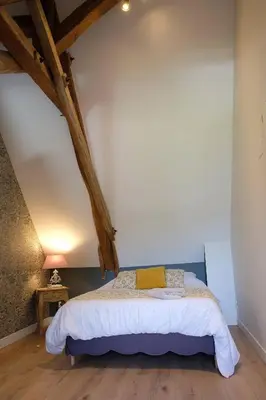 Un ou plusieurs lits dans un hébergement de l'établissement Le Clos des 2 Lys charmant gîte avec spa en Touraine