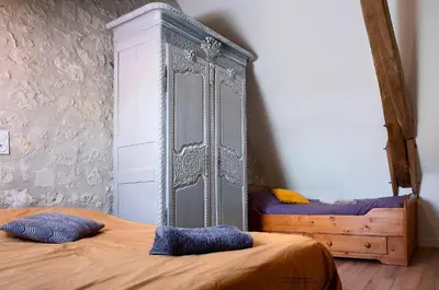 Un ou plusieurs lits dans un hébergement de l'établissement Le Clos des 2 Lys charmant gîte avec spa en Touraine