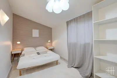 Un ou plusieurs lits dans un hébergement de l'établissement Maison familiale bords de Loire avec jardin et 3 Chambres