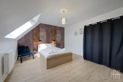 Un ou plusieurs lits dans un hébergement de l'établissement Maison familiale 4 chambres avec jardin et parking