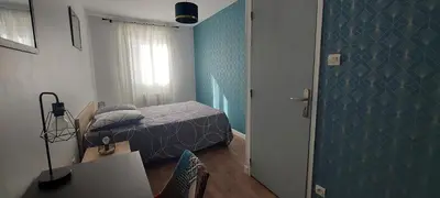 Un ou plusieurs lits dans un hébergement de l'établissement Le Georges Durand - Parking - 5 min du Circuit 24H - Wifi - 2 chambres