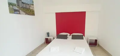 Un ou plusieurs lits dans un hébergement de l'établissement Gîte familial à Azay le Rideau avec Parking