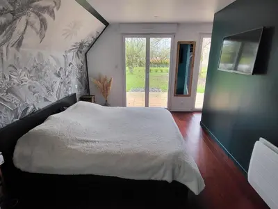 Un ou plusieurs lits dans un hébergement de l'établissement Maison moderne 180 m2, à 10 min du Circuit des 24h du Mans