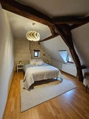 Un ou plusieurs lits dans un hébergement de l'établissement Au pied du Lavoir chambre Germaine