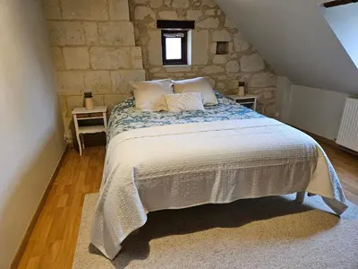Un ou plusieurs lits dans un hébergement de l'établissement Au pied du Lavoir chambre Germaine
