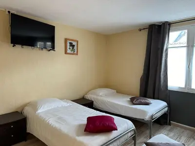 Un ou plusieurs lits dans un hébergement de l'établissement Maison de ville pour groupe, très proche du château de Villandry