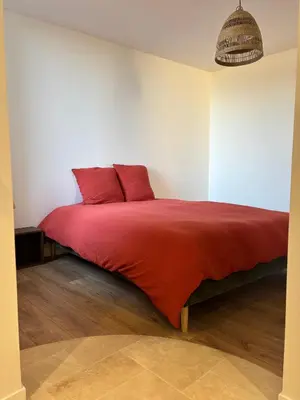 Un ou plusieurs lits dans un hébergement de l'établissement L appartement du château