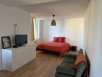 Télévision ou salle de divertissement dans l'établissement L appartement du château