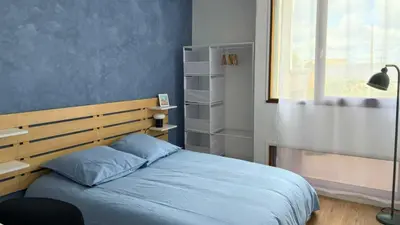 Un ou plusieurs lits dans un hébergement de l'établissement Appartement 4 chambres Idéal 24h moto & voiture