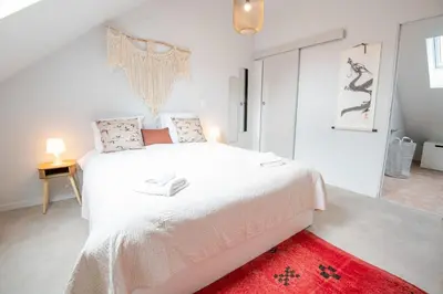 Un ou plusieurs lits dans un hébergement de l'établissement AU VINCI Appartement 4 personnes